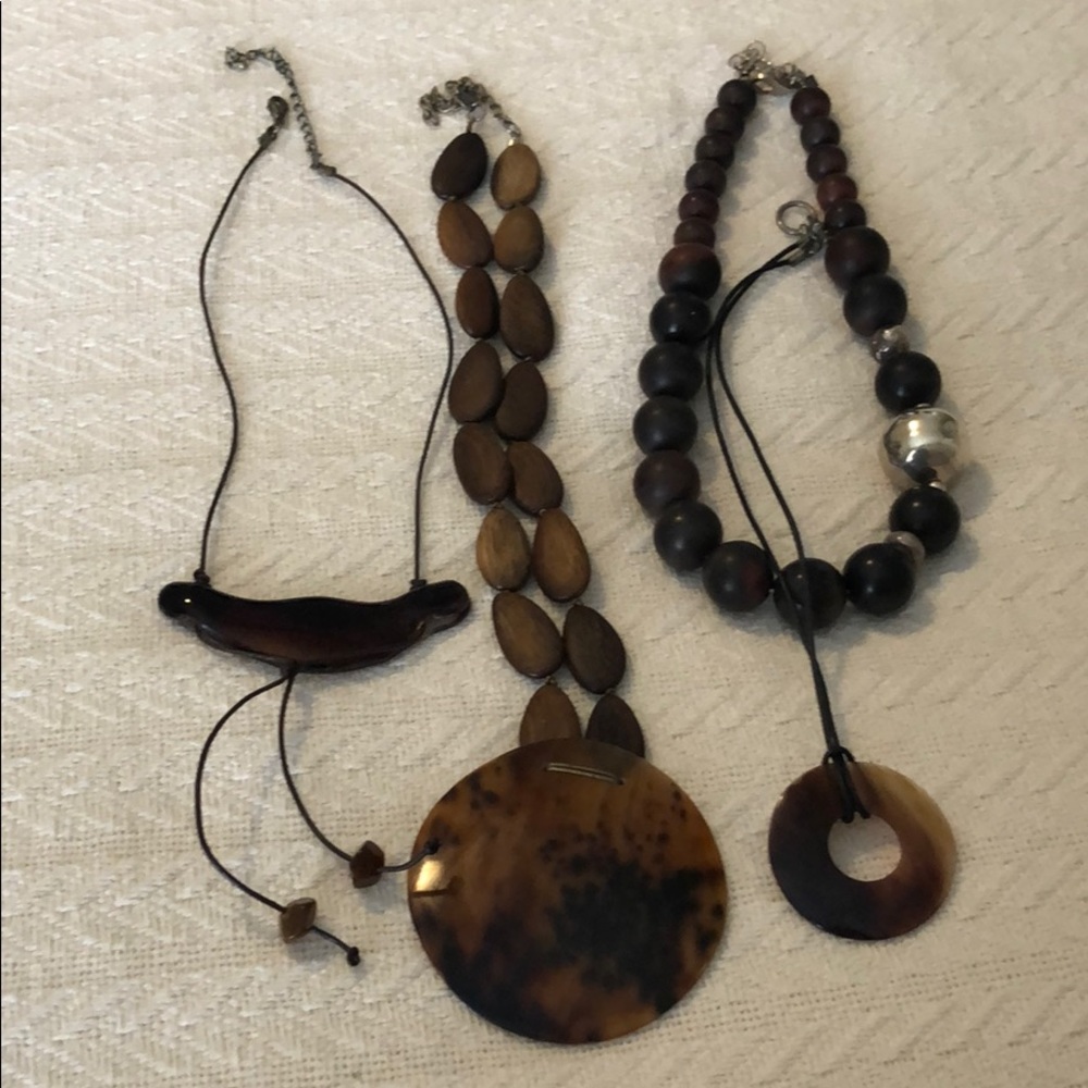 Collection 4 wood, resin horn necklaces.